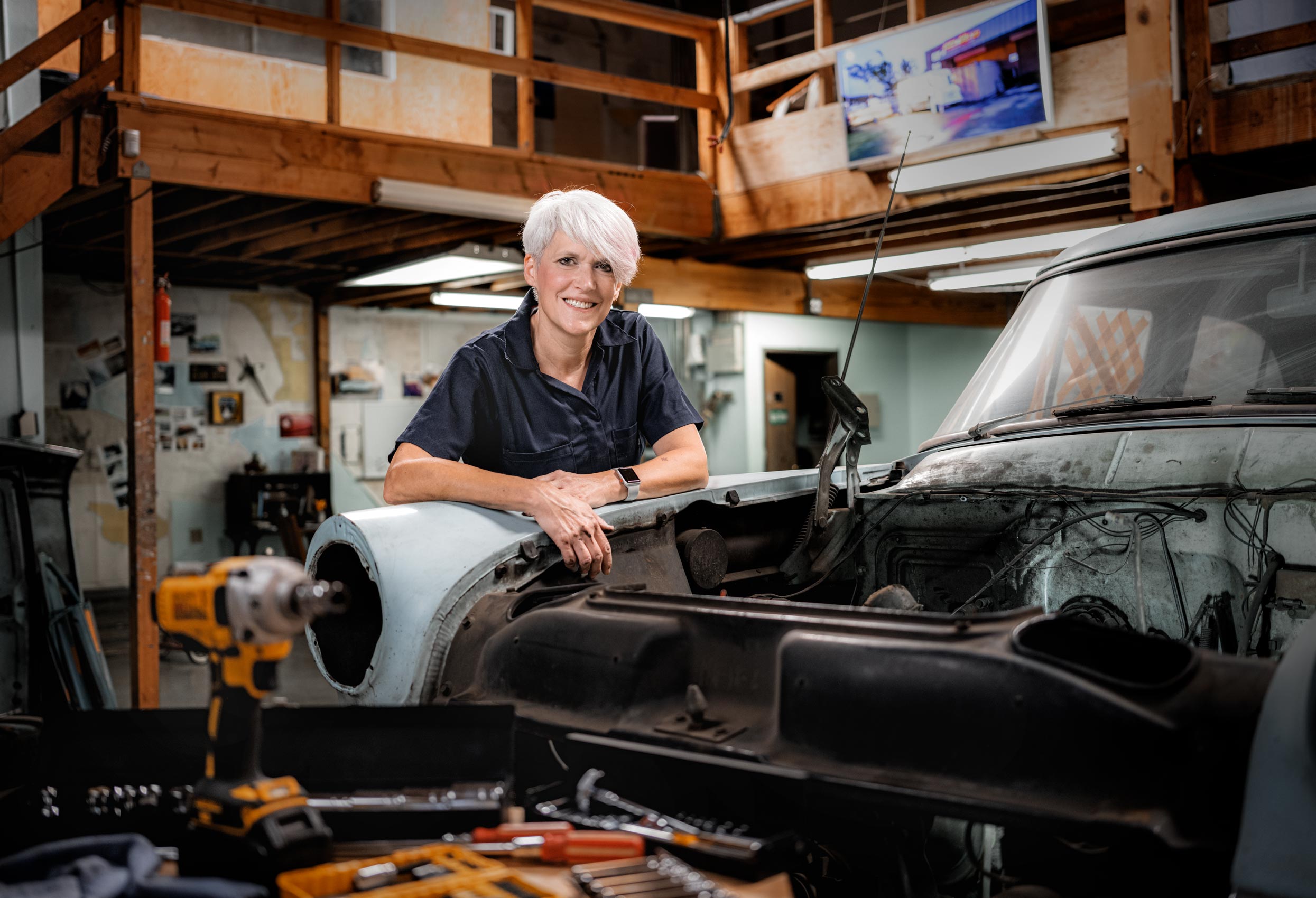 Portrait of a woman in an auto garage